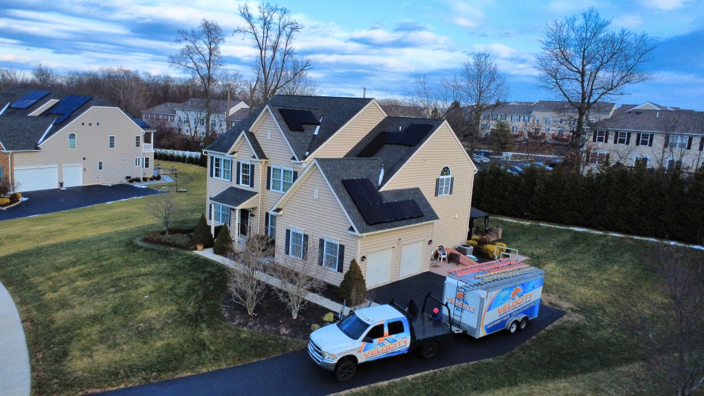 Velocity Energy install truck and equipment trailer on site at a customer's home
